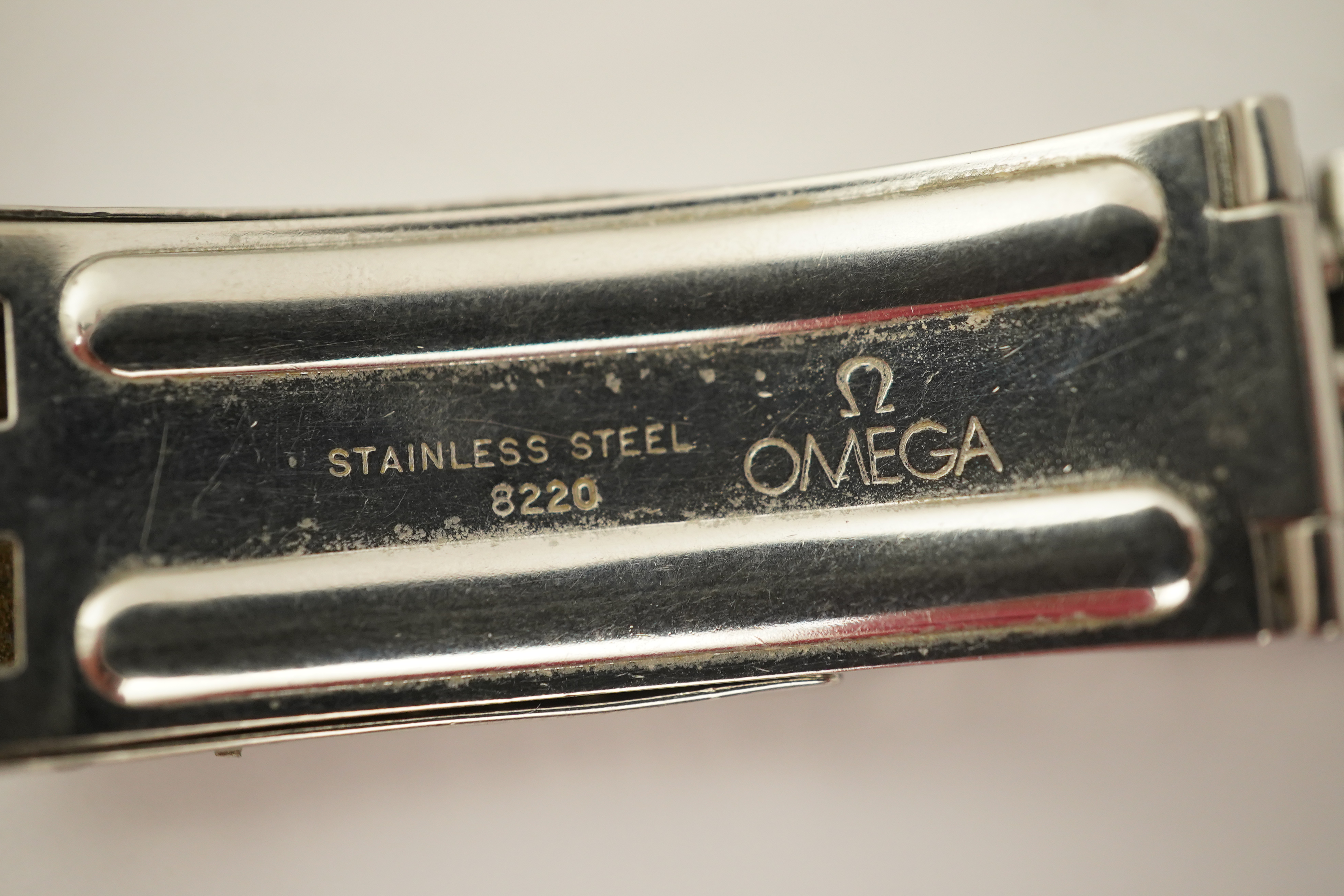 A gentleman's 1960's? stainless steel Omega Seamaster automatic wrist watch, on a stainless steel Omega bracelet